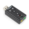 Black external USB sound card with 3.5mm headphone and mic jacks connected to a laptop