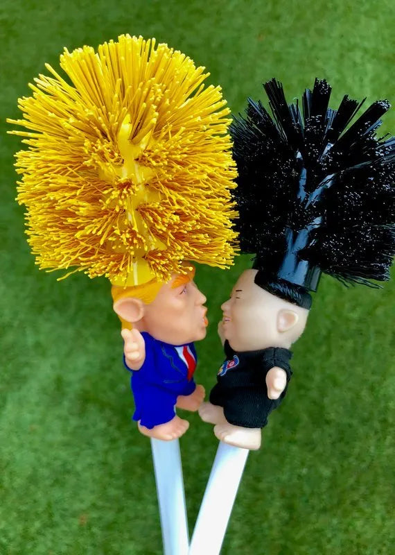 Yellow plastic Donald Trump novelty toilet brush with hanging slot, 40cm length