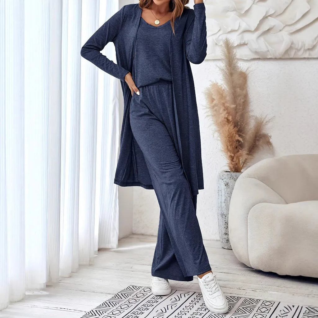 Blue women's three-piece casual suit set with trousers, top, cardigan, and suspenders laid flat.