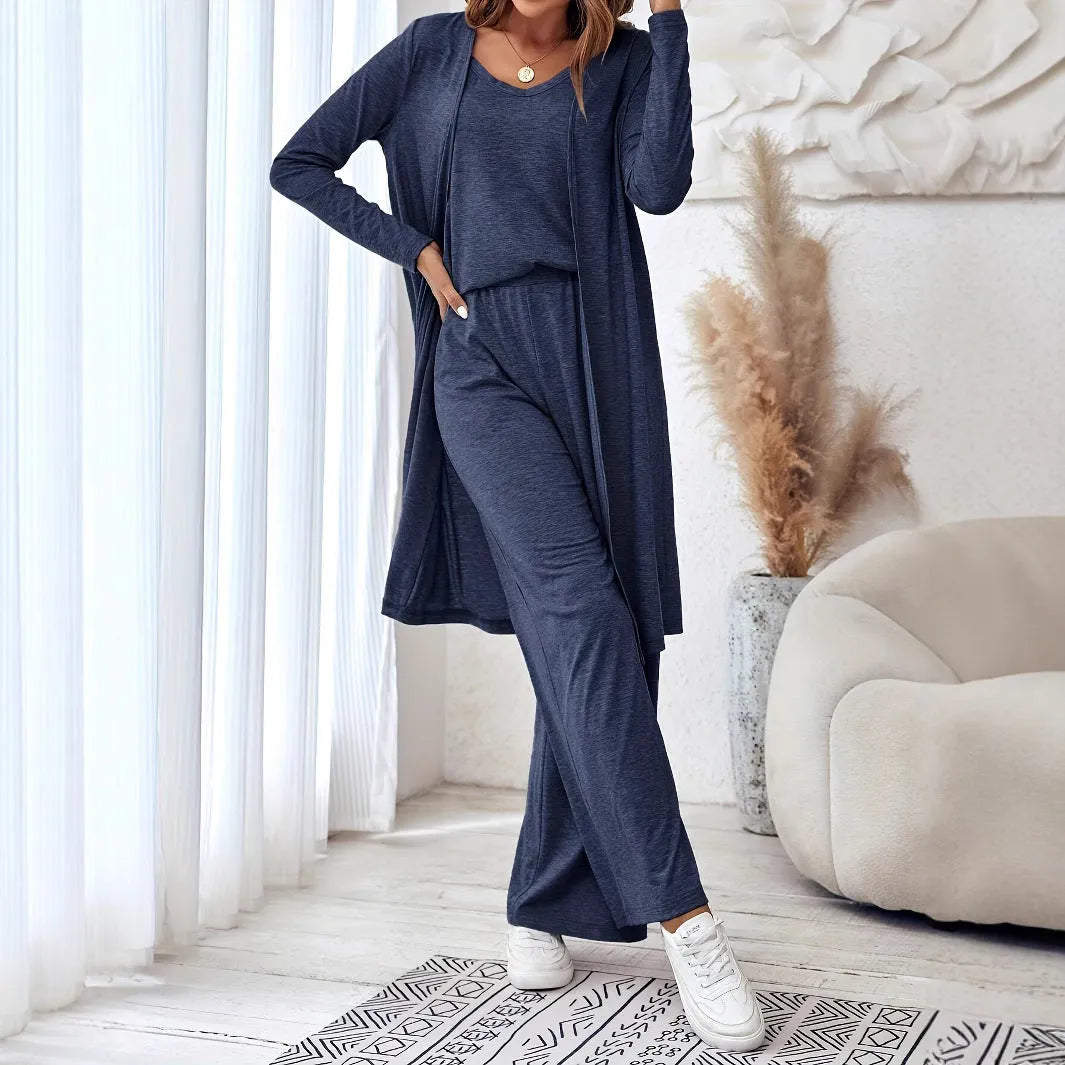 Blue women's three-piece casual suit set with trousers, top, cardigan, and suspenders laid flat.