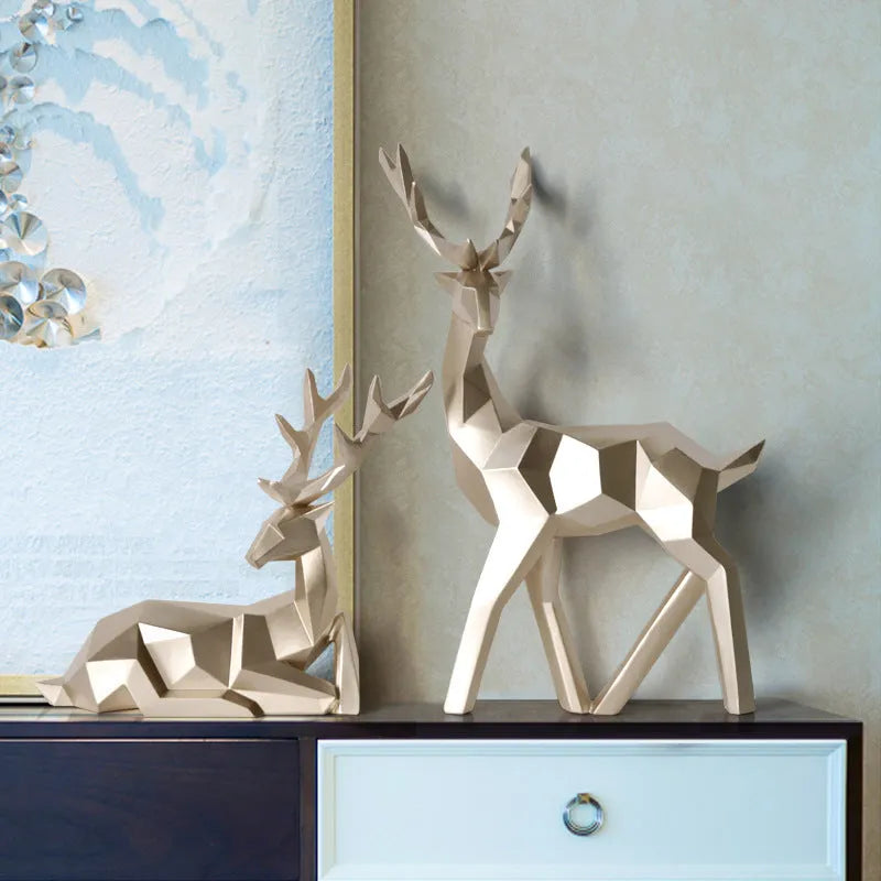 Modern resin deer statue decoration in a choice of colours including black, blue, gold, green, white, and white and black.