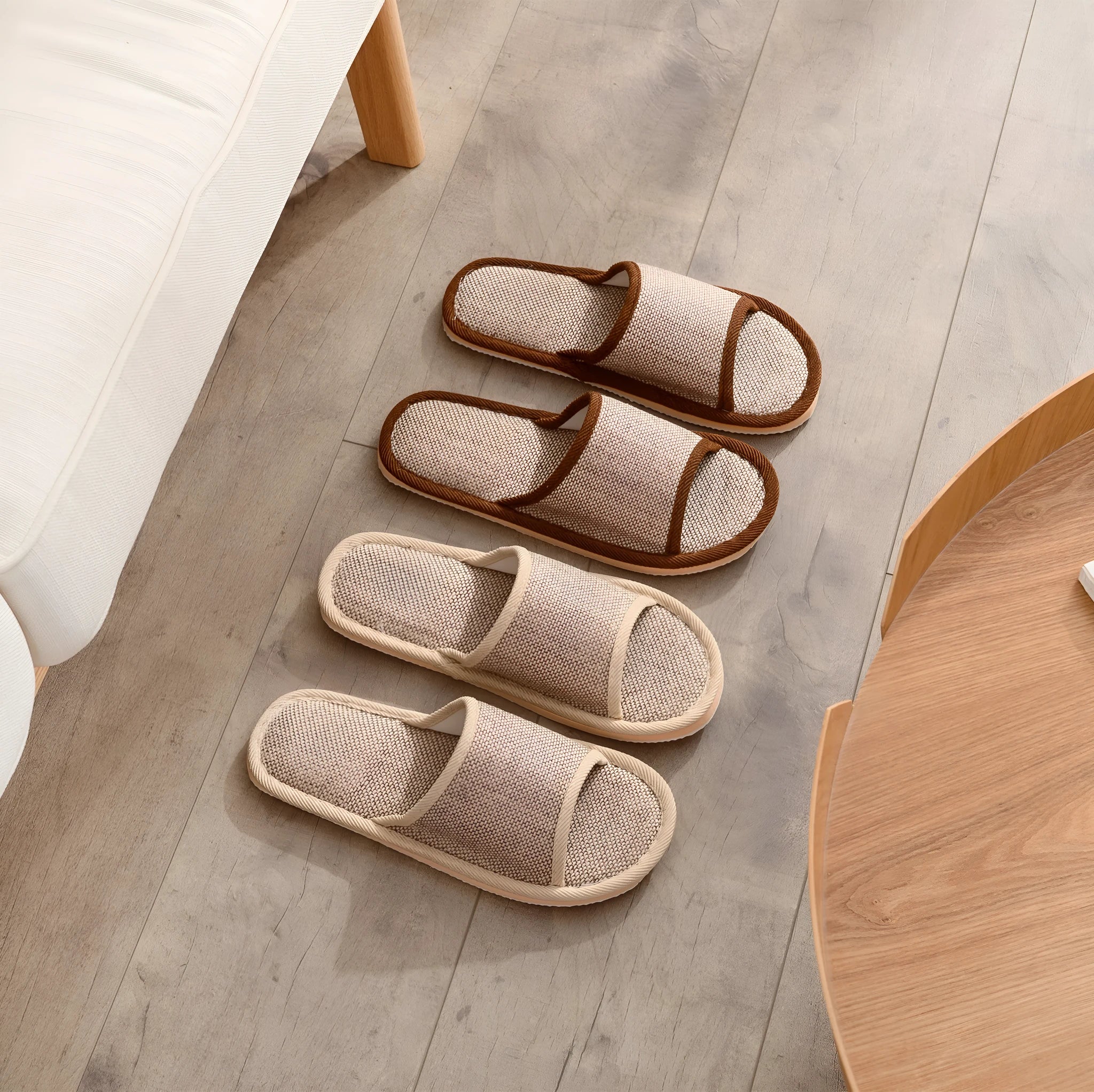 Women's open-toe linen slippers in a light brown colour showing the breathable fabric and thickened sole.