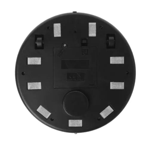 Compact silver automatic vacuum cleaner robot on a wooden floor