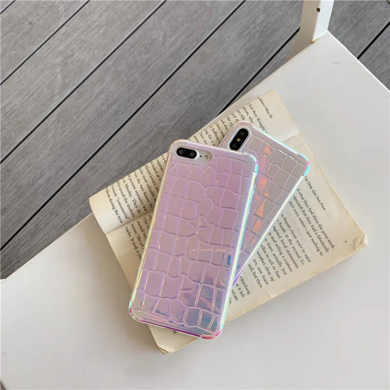 Silver glossy silicone laser phone case with textured surface for iPhone, showing lanyard hole and precise camera cutout.