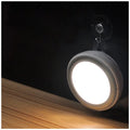 Compact round white motion sensor LED light unit for cupboards and hallways.
