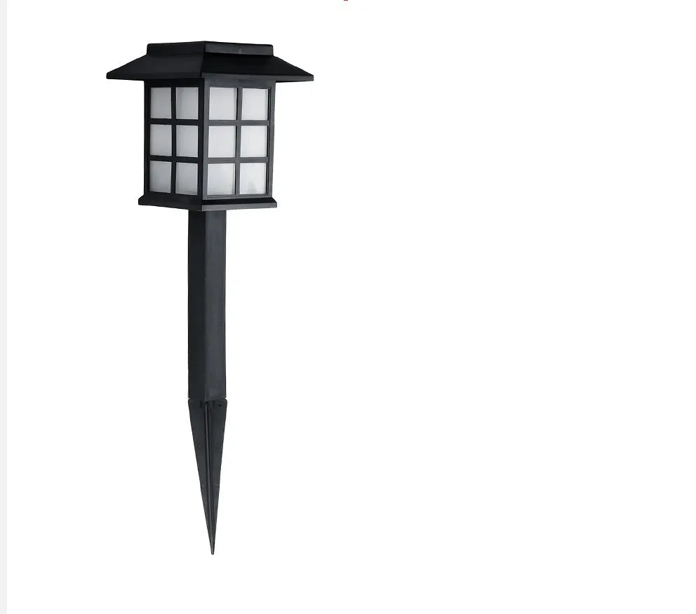 Black solar-powered LED lawn light for outdoor garden and pathway illumination.