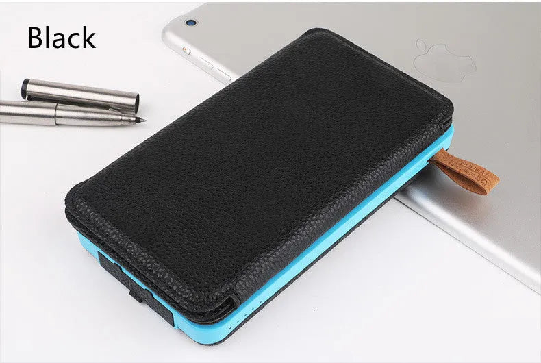 Outdoor solar power bank in orange with a solar panel, LED light, and leather texture, shown next to a charging cable.