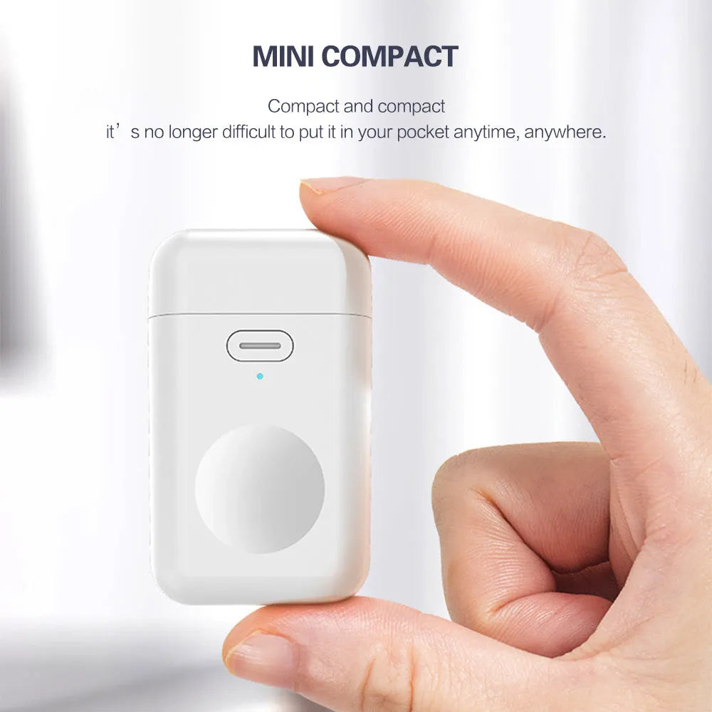White 1000mAh wireless magnetic portable charger for Apple Watch next to an Apple Watch