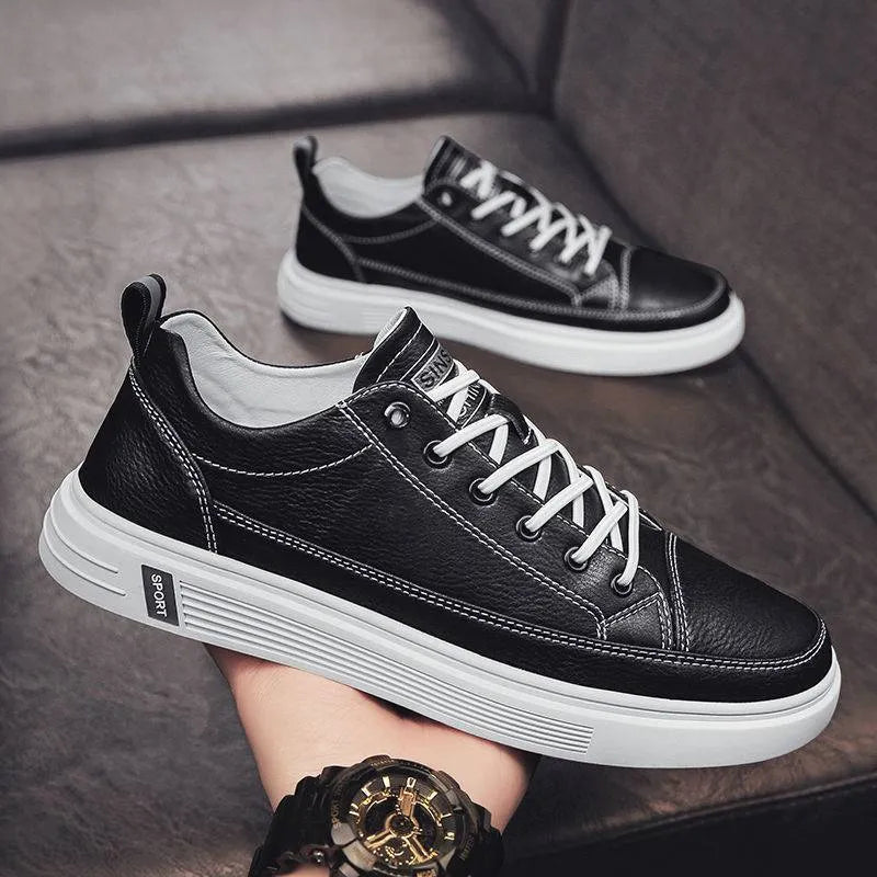 Men's casual white flat shoes with round toe and shallow mouth design on a plain background