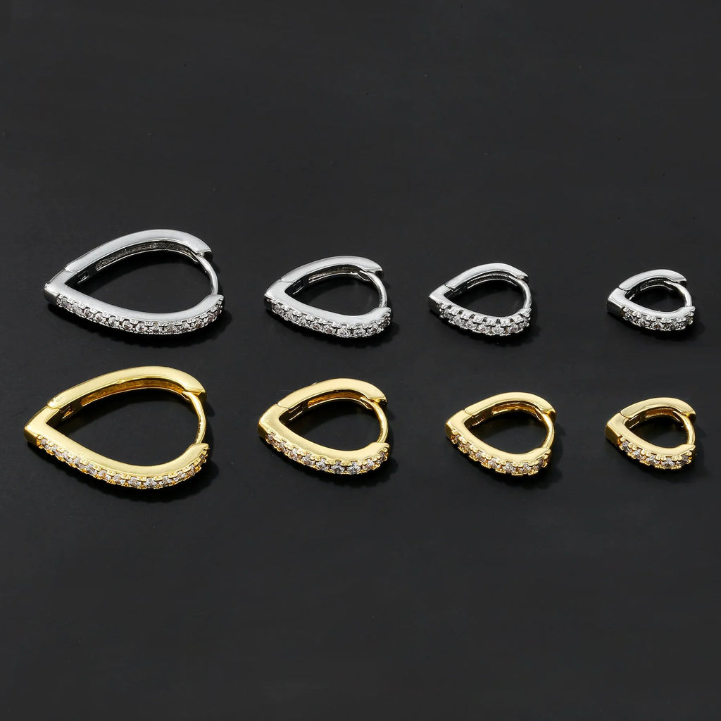 A geometric heart-shaped ear clip for women in electroplated copper, shown in gold and white K colour options.