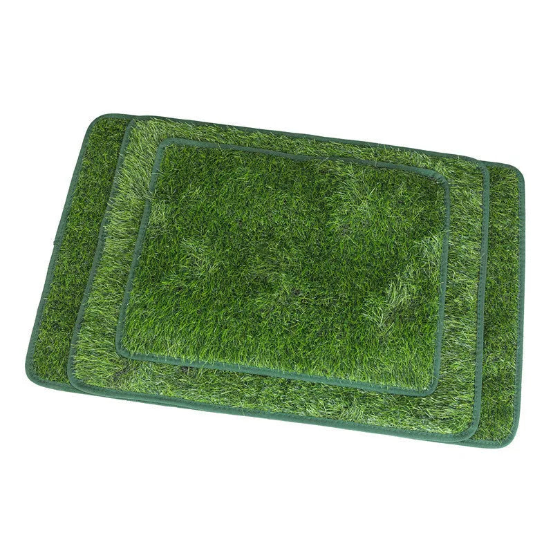 Green washable dog grass pee training mat with realistic lawn texture on a patio.