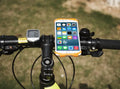 Silicone bicycle phone holder mounted on a handlebar showing its three-hole adjustment system.