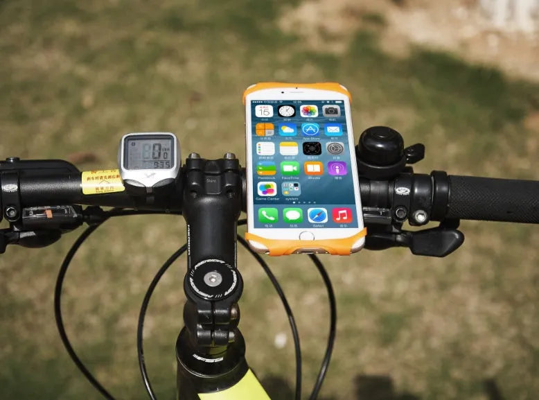 Silicone bicycle phone holder mounted on a handlebar showing its three-hole adjustment system.