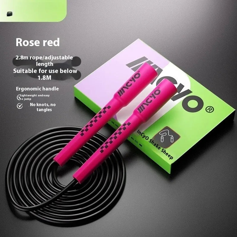 Colourful PVC fitness skipping rope for physical exercise on a plain background