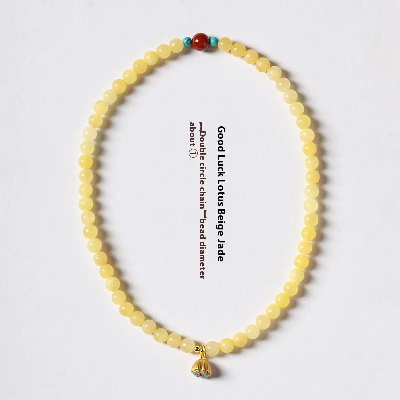 Handmade yellow jade topaz double ring bracelet with lotus seedpod design on 6mm or 8mm beads.