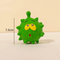 Set of four colourful squeaky dog balls with cute faces, made from natural latex rubber.