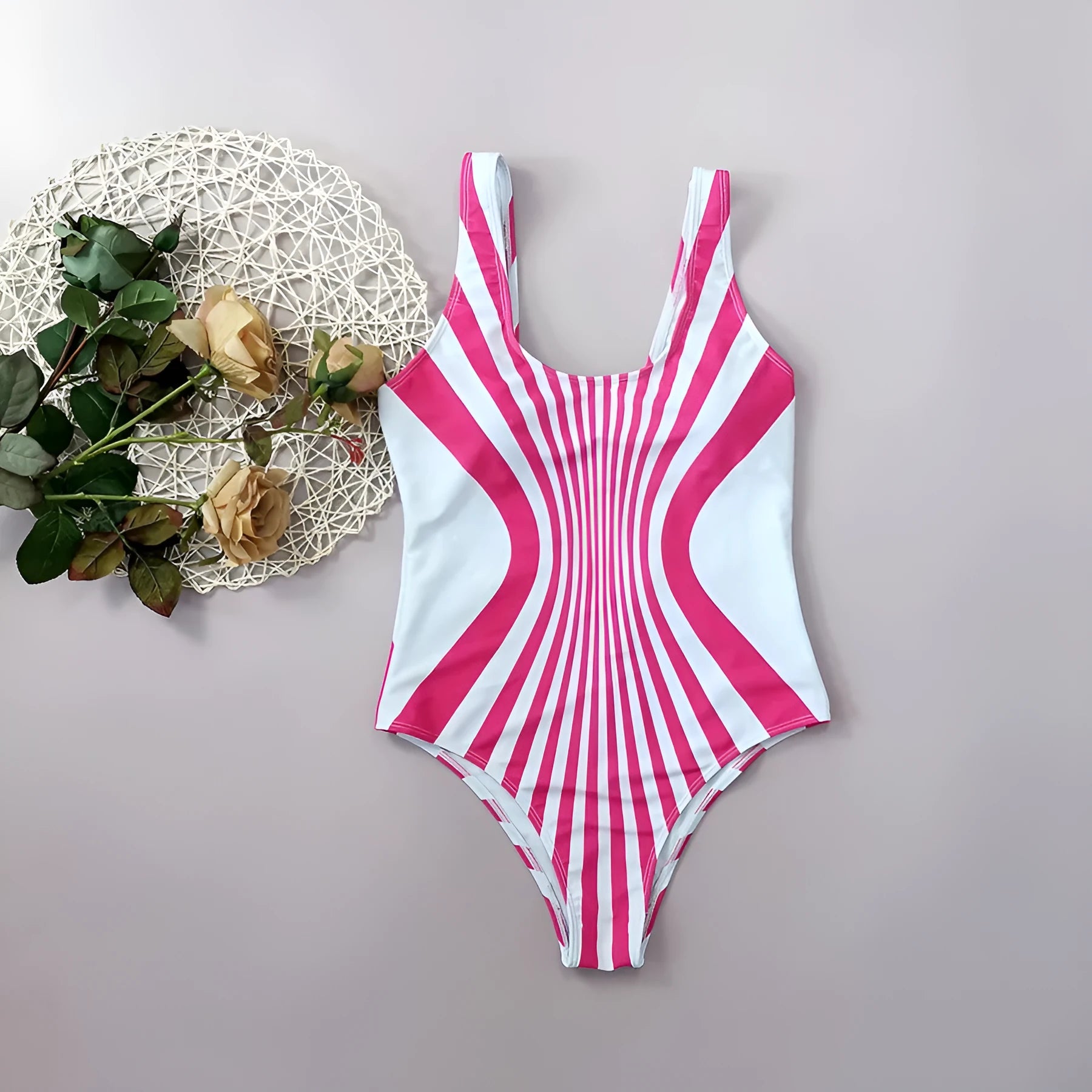 Pink striped women's one-piece swimsuit with all-over digital print on front and back.