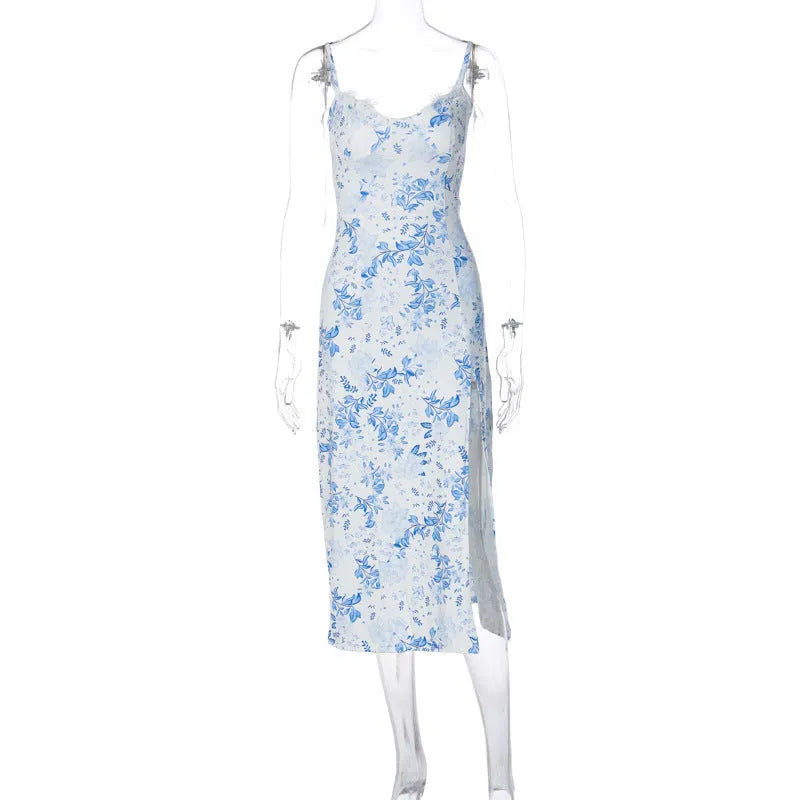 Blue long dress with white lace flower print, featuring a thigh slit and thin suspender straps.