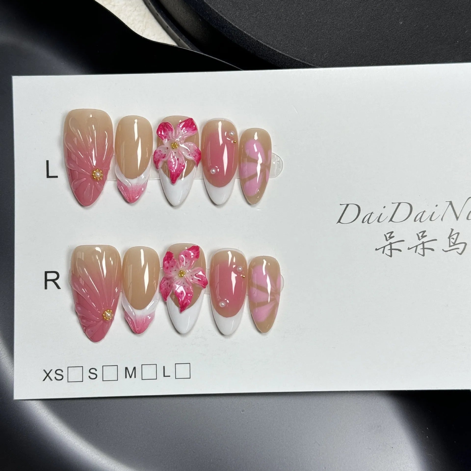 3D French style lily and ice flower plastic nail decoration in almond shape on a nail.