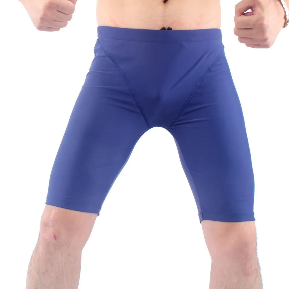 Men's green and navy blue quick-dry swimming trunks with anti-embarrassment lining, loose plus-size fit.