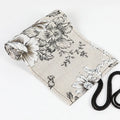 Black Peony floral print cotton hemp pencil roll bag, shown open with 24 holes.
