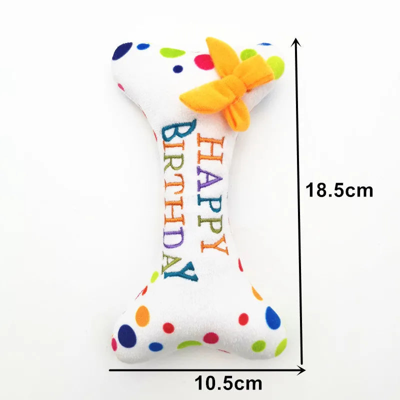 Four-piece dog birthday cake plush toy set including big cake, small cake, gift box, and bone on white background