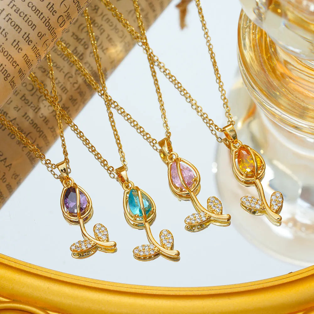 Gold tulip flower pendant necklace on an O-ring chain, showing adjustable length from 41cm to 50cm.