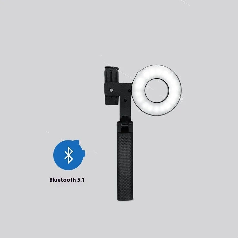 Black portable handheld LED fill light for mobile phone photography with adjustable brightness settings