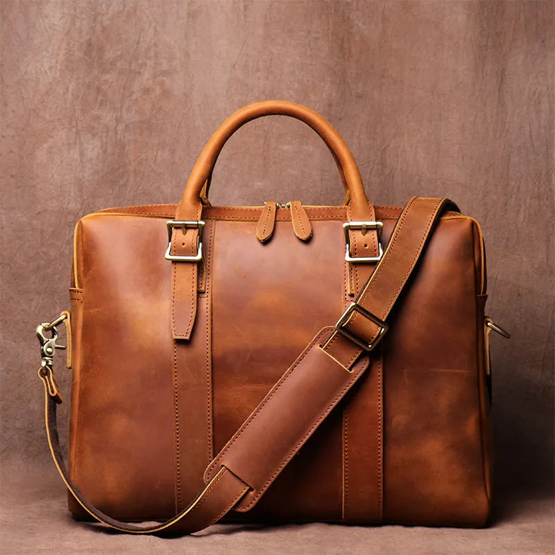 Men's large brown cow leather vintage handbag with zip closure, handle, shoulder strap, and 15 inch laptop space