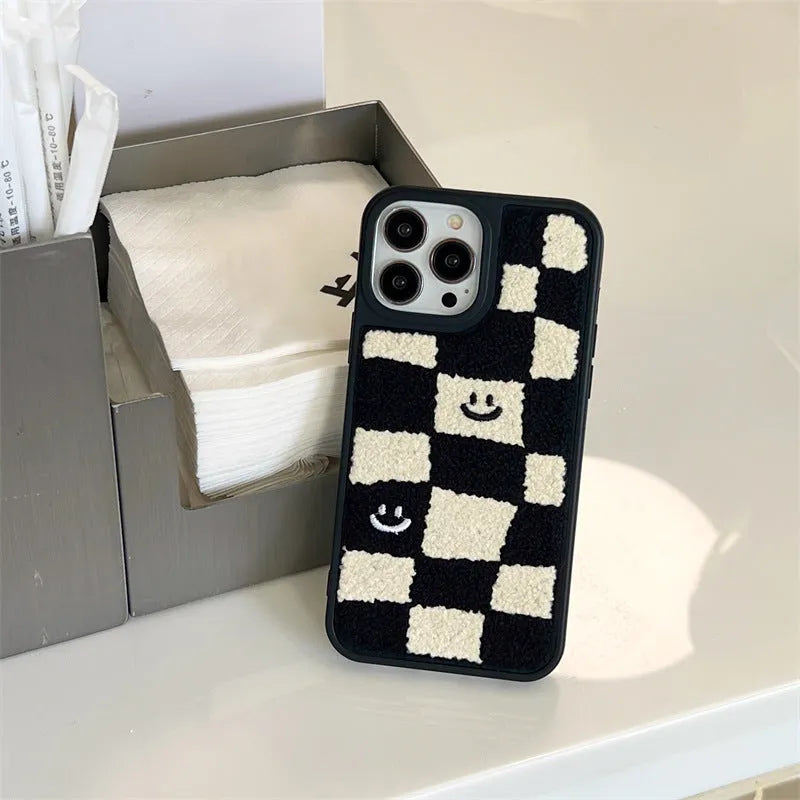 Black and white chessboard TPU phone case for iPhone with precise cutouts on a white background