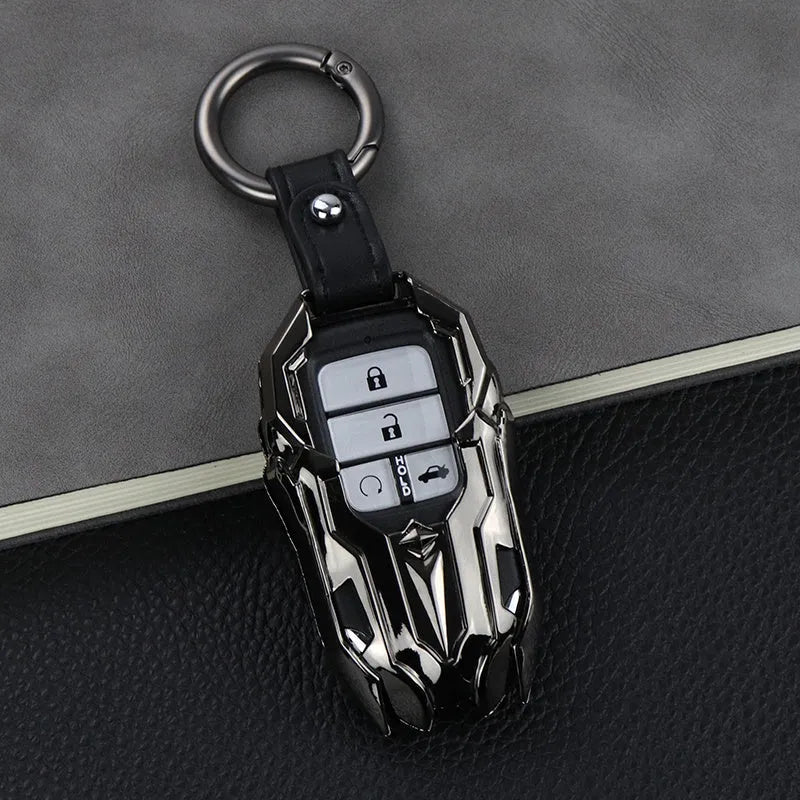 Black zinc alloy car key cover with highlight polish finish protecting a key fob