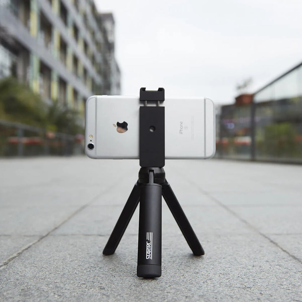 Silver aluminium bracket clip for mounting an iPhone onto a table top tripod.