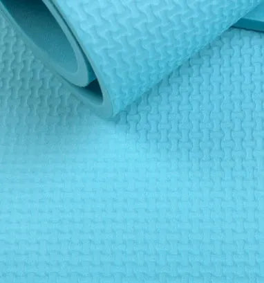 Red and blue EVA yoga mats showing 4mm and 6mm thickness options rolled up with storage bag.