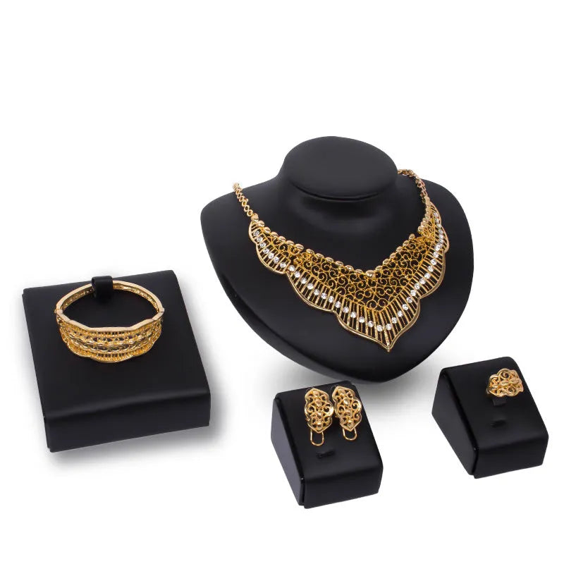 Wild style alloy necklace and earrings set in gold colour with diamond-cut finish and mixed gem inlay pendant