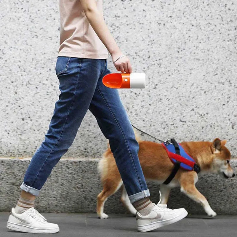 White and grey Moestar Rocket portable pet drinking cup with a one-button lock.