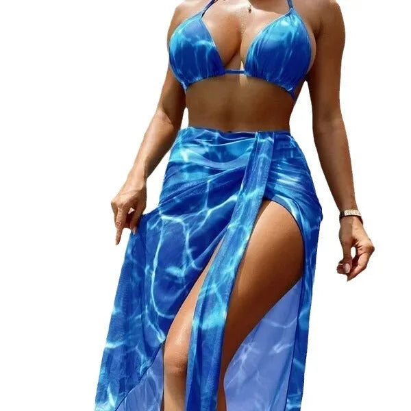 Women's three-piece bikini swimsuit set with floral pattern in blue, polyester fabric, includes top pants and skirt