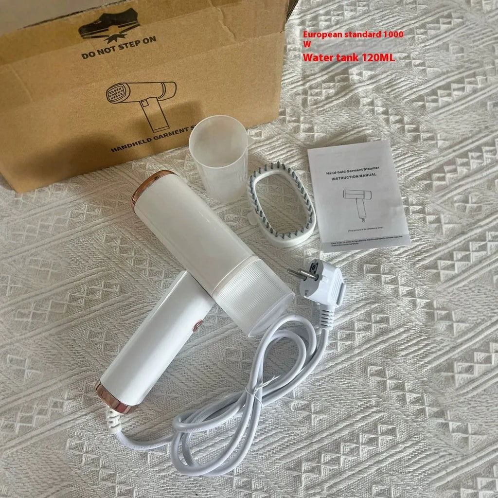 Portable handheld garment steamer in white foldable design with non-stick liner and UK plug