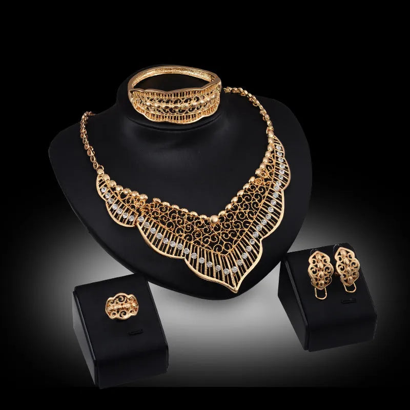 Wild style alloy necklace and earrings set in gold colour with diamond-cut finish and mixed gem inlay pendant