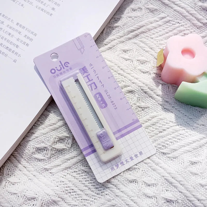 Small plastic blade art knife in blue, pink, purple, khaki or orange for cutting packages and paper