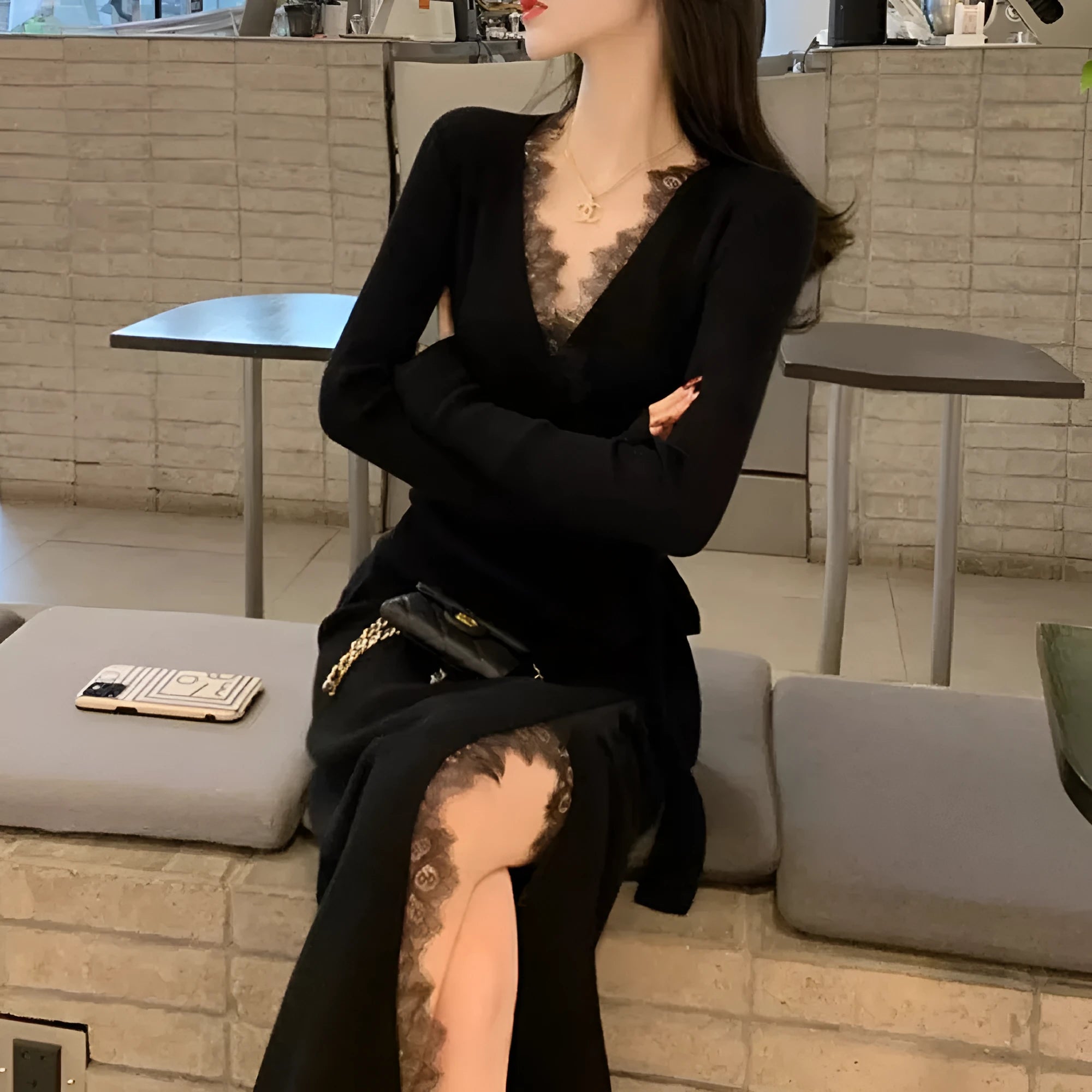 Black women's slim fit woolen skirt with a princess dress silhouette on a mannequin.