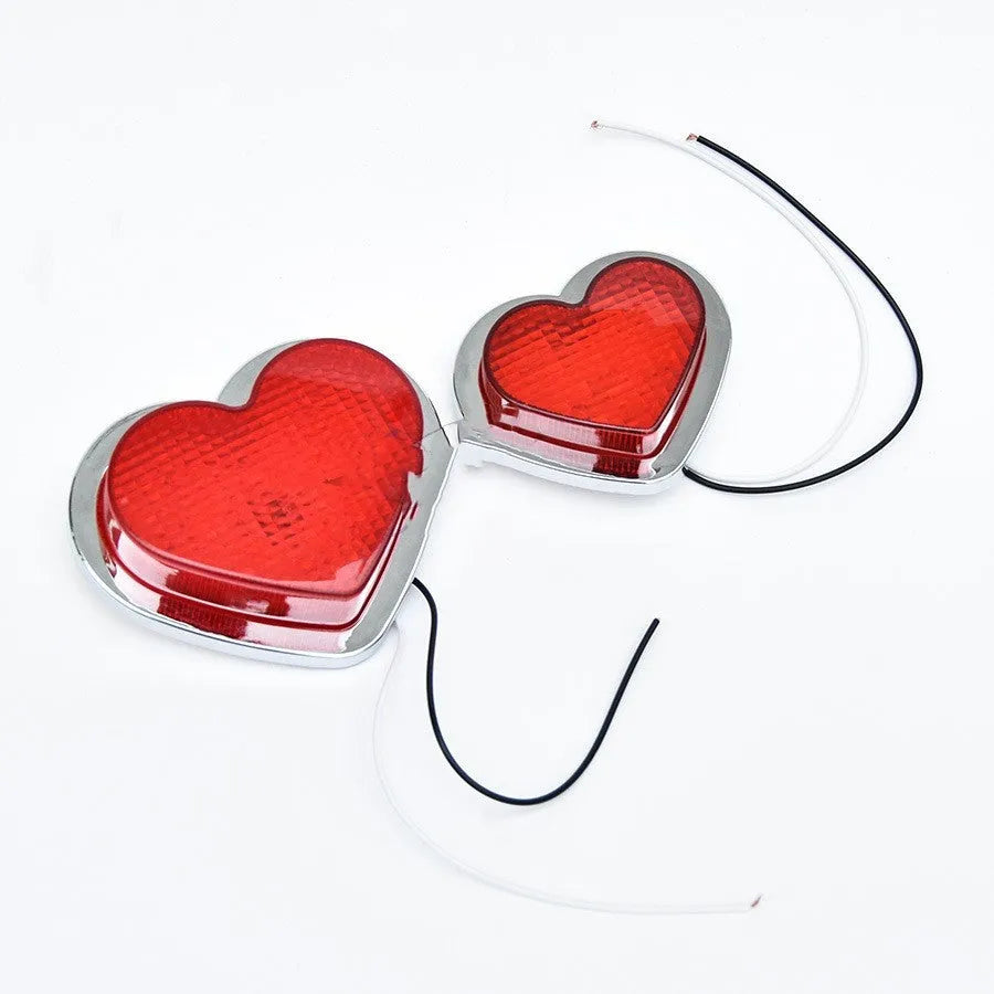 Heart-shaped red LED automotive sidelight mounted on car fender