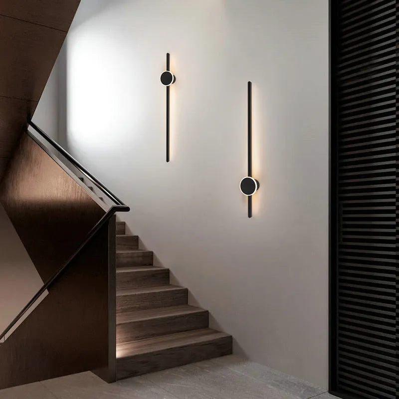 Simple modern wall lamp with a long acrylic shade and grid-free strip light design.