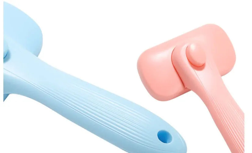 New Pet Needle Comb for dogs and cats, plastic construction, available in pink and blue, lightweight grooming brush