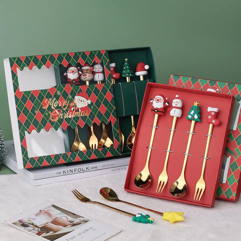 Red stainless steel Christmas spoon and fork set with festive handle designs including trees and snowmen