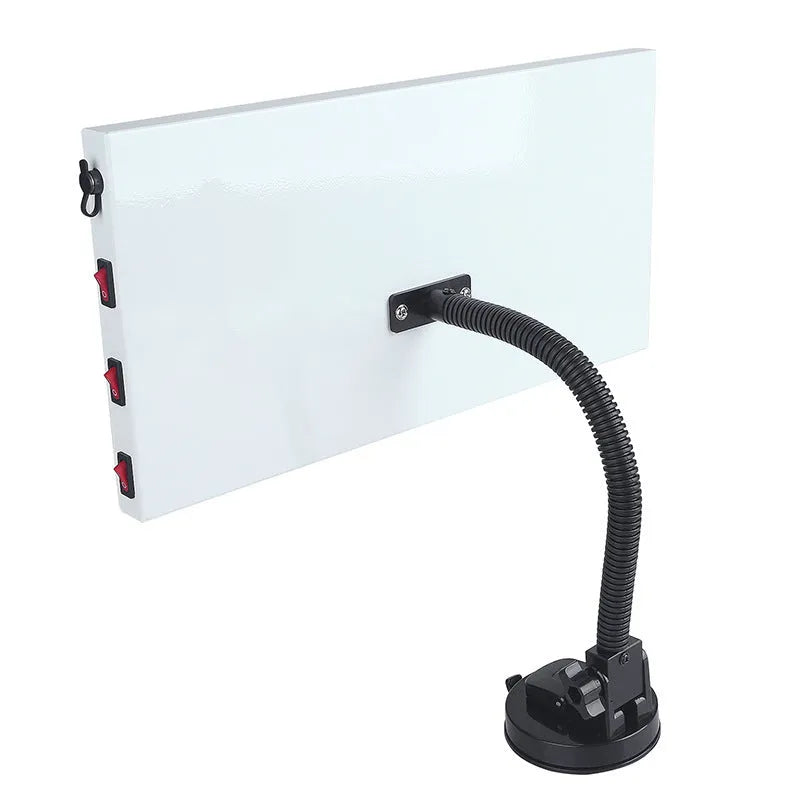 White MPT X009 car dent repair detector suit with concave inspection light on a workshop bench.