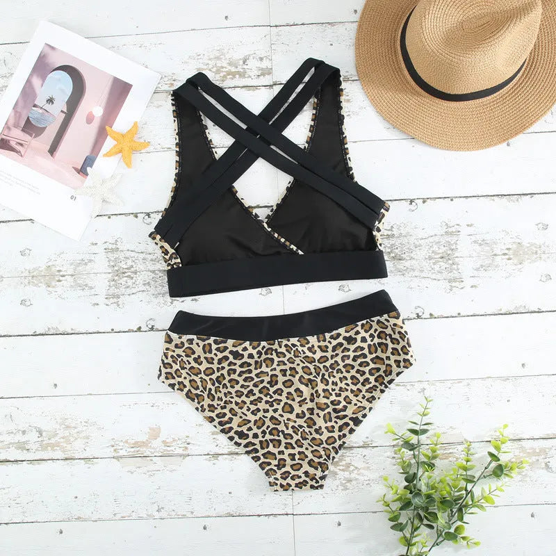 Women's leopard print cross band bikini with V-neck and briefs on a white background.