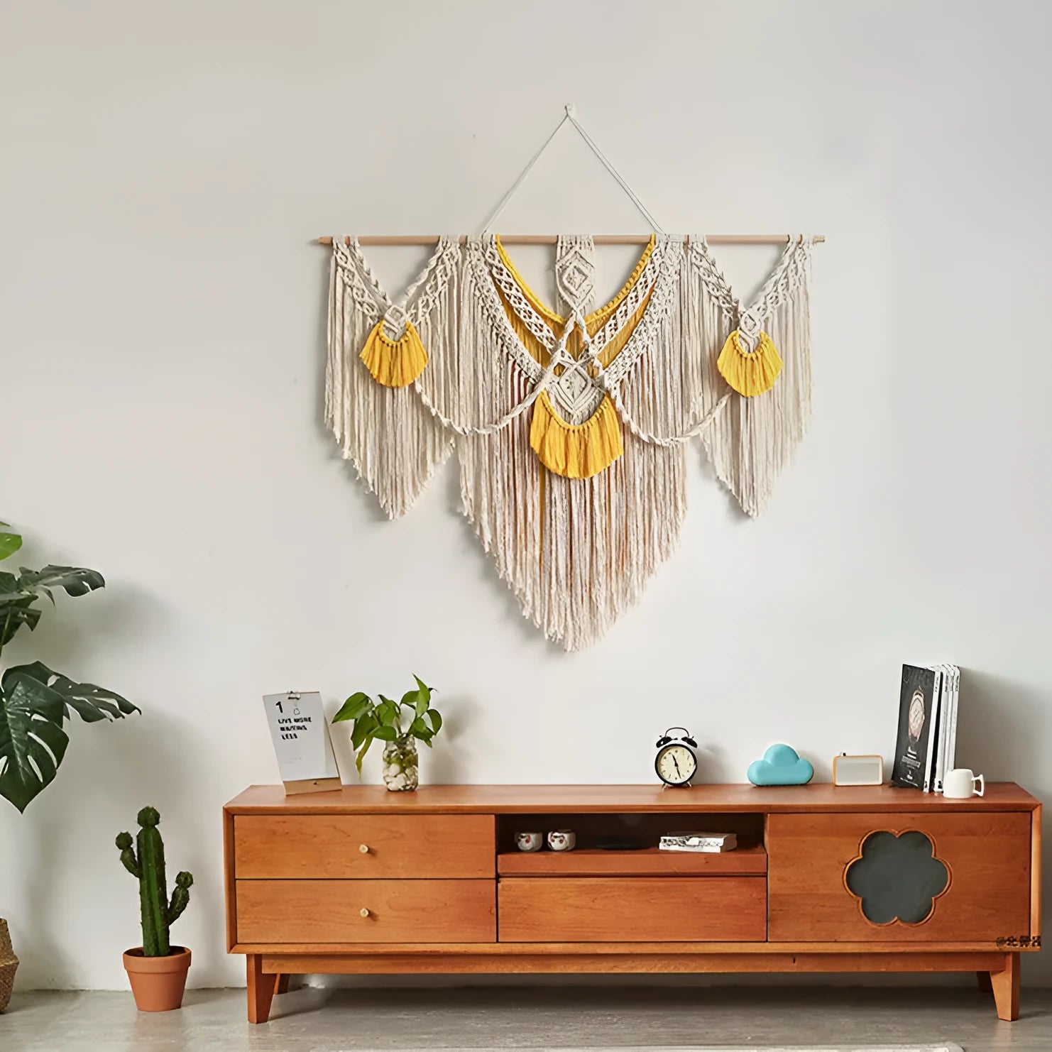 Creamy white hand-woven cotton Nordic tapestry hanging on a wall, rectangular shape 120cm by 95cm.