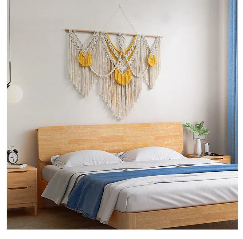 Creamy white hand-woven cotton Nordic tapestry hanging on a wall, rectangular shape 120cm by 95cm.