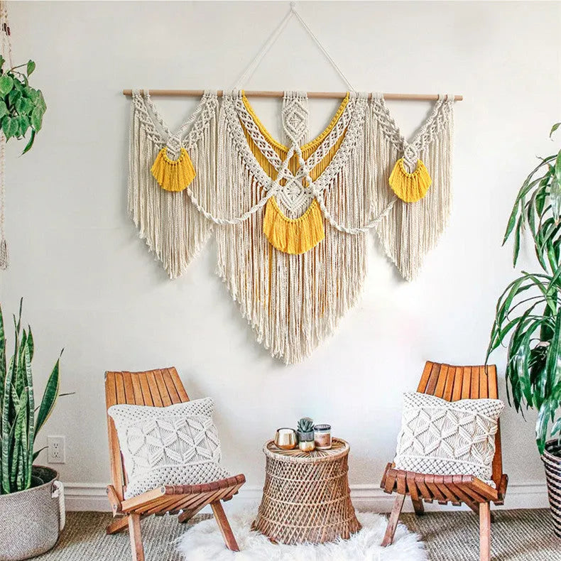 Creamy white hand-woven cotton Nordic tapestry hanging on a wall, rectangular shape 120cm by 95cm.
