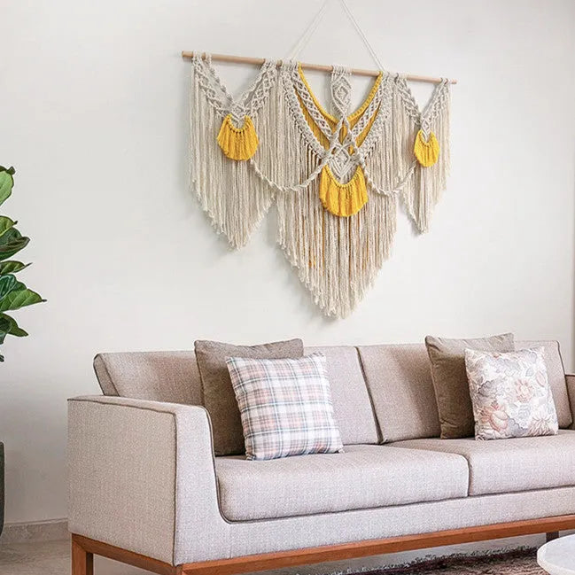 Creamy white hand-woven cotton Nordic tapestry hanging on a wall, rectangular shape 120cm by 95cm.